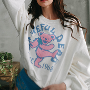 "Close-up of 'Grateful Dead 1965' collegiate-style lettering on white sweatshirt