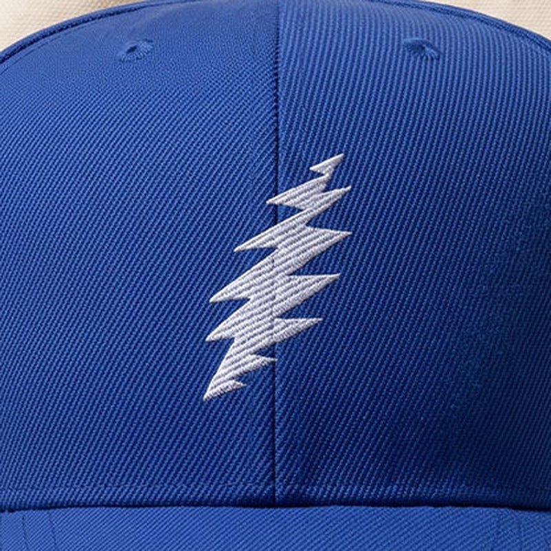Close-up of the design on the Grateful Dead Embroidered White Bolt Snapback Hat - Royal