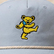 Close-up of the design on the Grateful Dead Embroidered Yellow Bear Rope Hat - Powder Blue