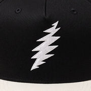 Close-up of the design on the Grateful Dead Embroidered White Bolt Two-Tone Hat - Black/Natural