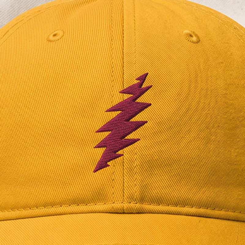 Close-up of the design on the Grateful Dead Embroidered Maroon Bolt Dad Hat - Gold