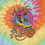 Close-up of Enjoying The Ride graphic on kids tie-dye t-shirt