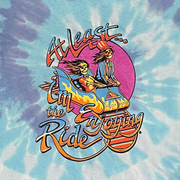 Close-up of Enjoying the Ride T-shirt graphic featuring dancing skeletons and vintage concert style typography