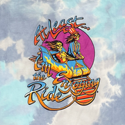 Close-up of vintage Enjoying The Ride graphic on tie-dye t-shirt