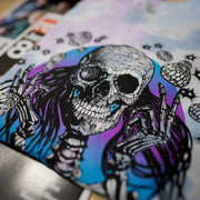 Close-up of psychedelic floating orbs graphic on tie-dye t-shirt
