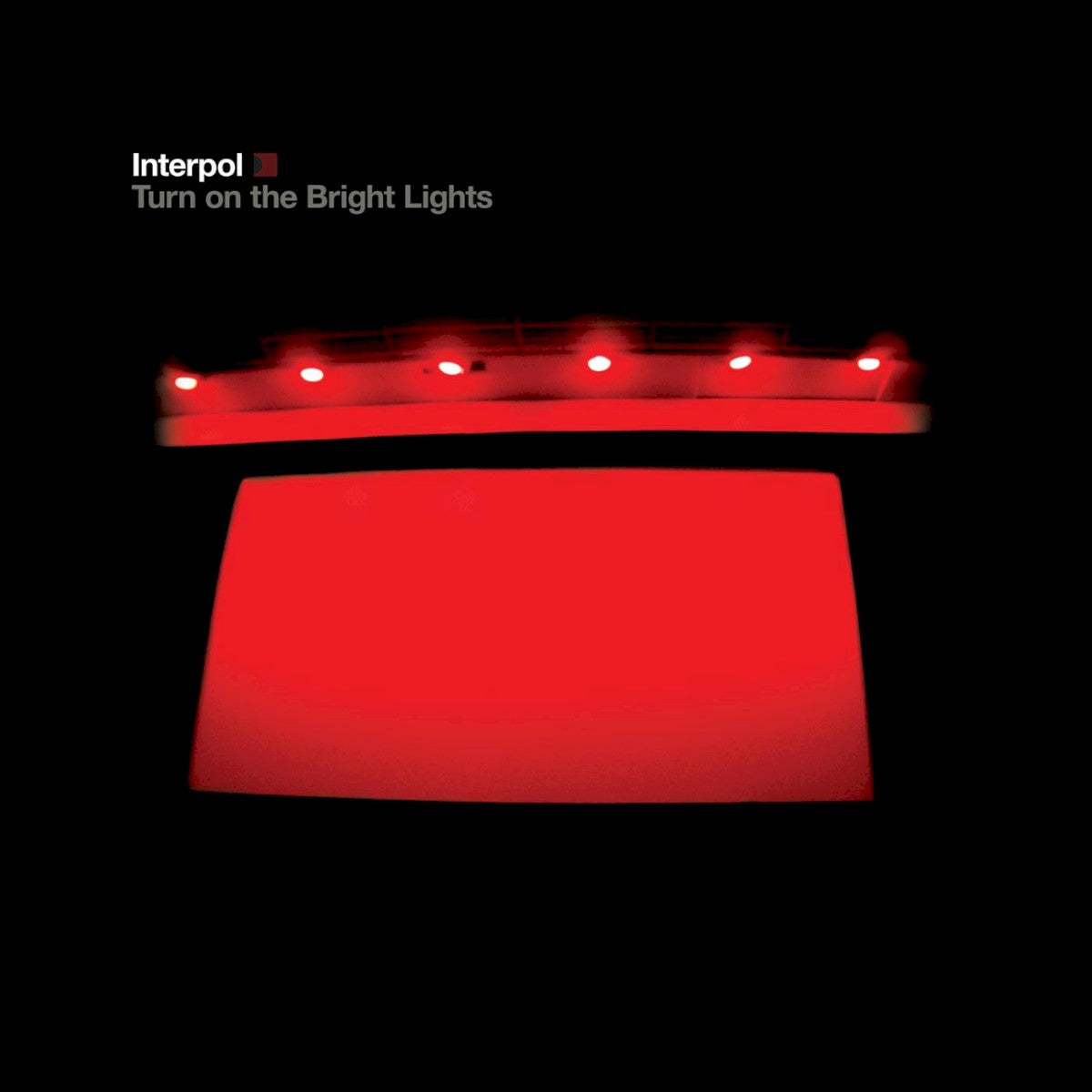 Front Cover: Interpol – Turn on the Bright Lights CD | Relix