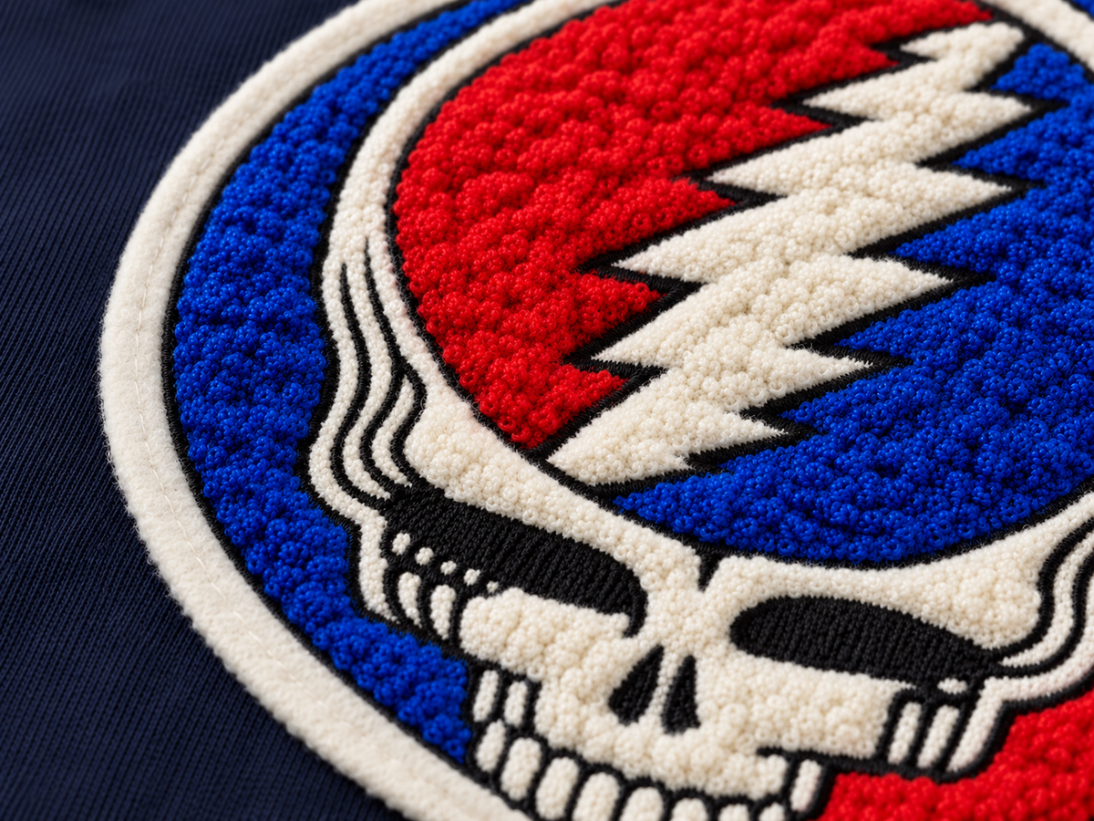 Close-up of the chenille Stealie design on the Navy hoodie
