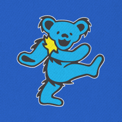 Close-up of the embroidered cyan bear on a royal blue bucket hat