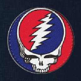 Close-up of the embroidered Stealie patch on a midnight navy thermal long-sleeve t-shirt