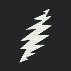 Close-up of the embroidered white bolt on a black bucket hat