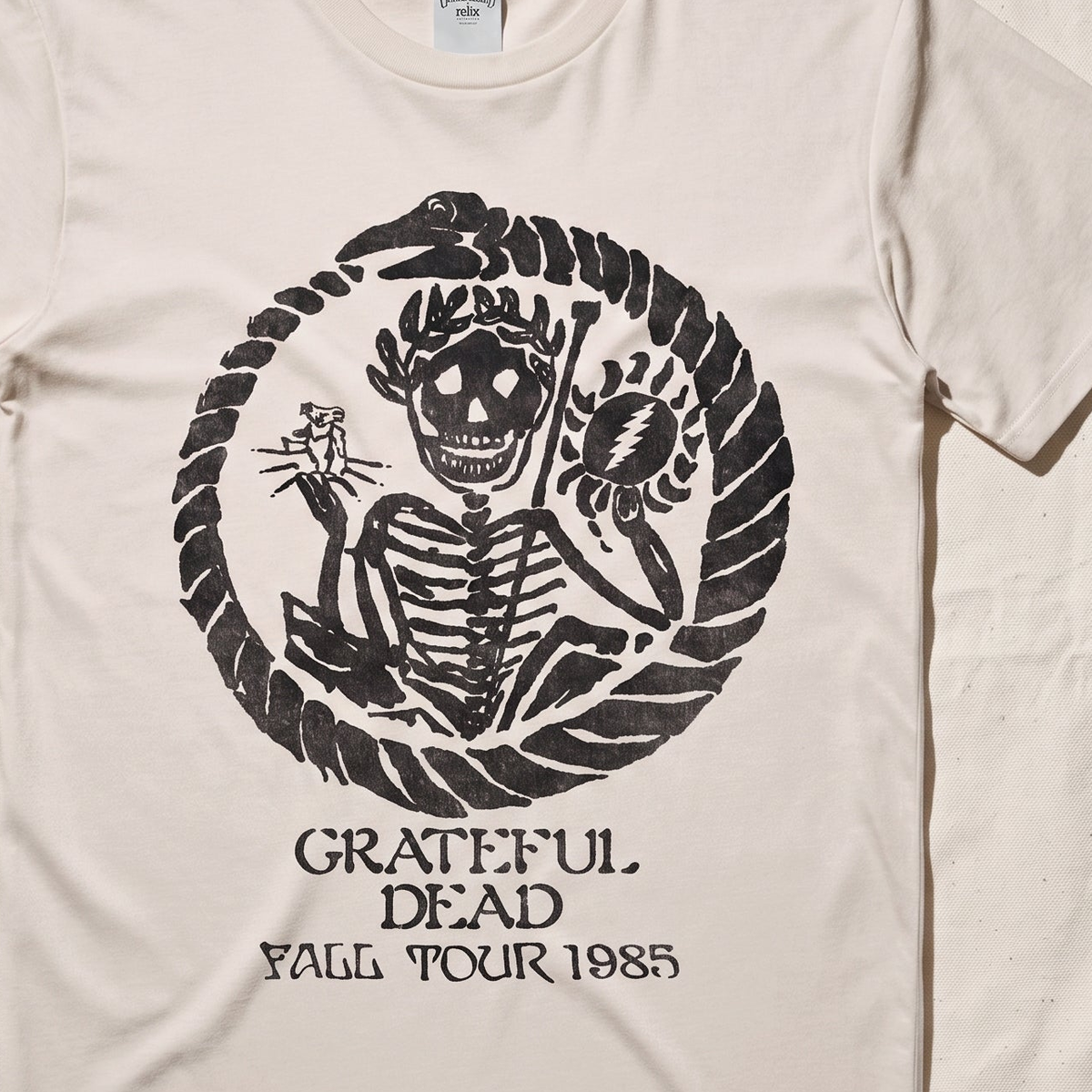 Close-up of the Fall Tour 1985 print on an ivory t-shirt