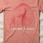 Close-up of the Howl at the Moon print on a terracotta t-shirt