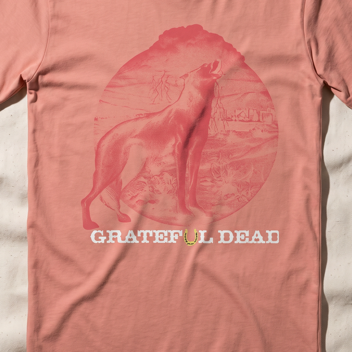 Close-up of the Howl at the Moon print on a terracotta t-shirt