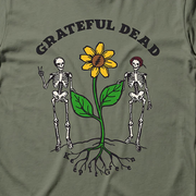 Close-up of the Keep It Green print on a moss t-shirt