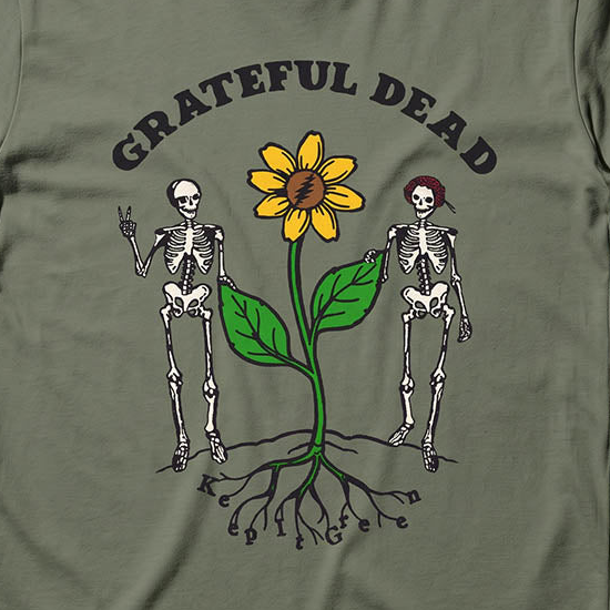 Close-up of the Keep It Green print on a moss t-shirt
