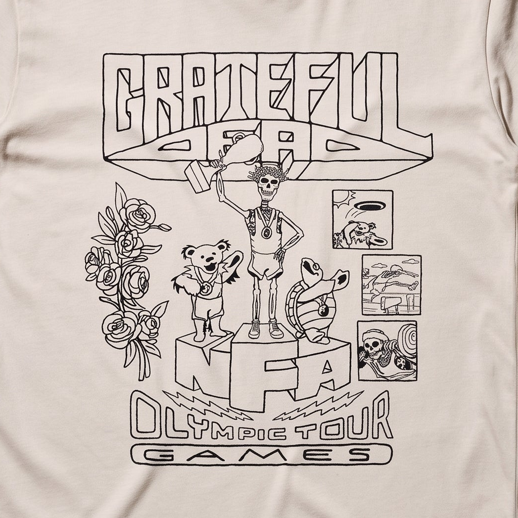 Close-up of the Olympic Tour Games print on an ivory t-shirt