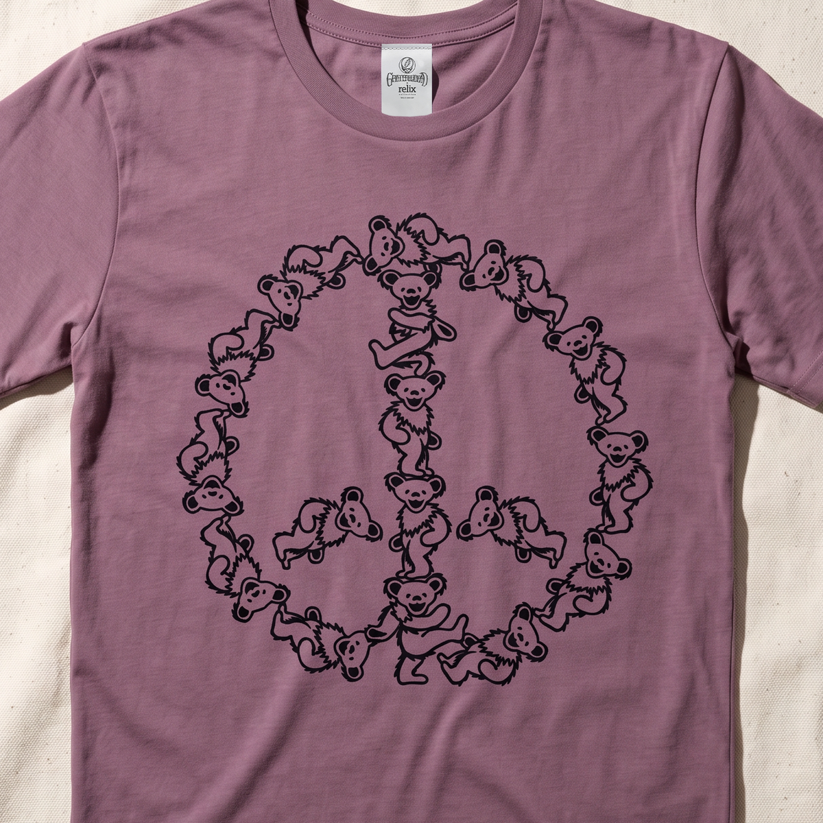 Close-up of the Peace Bears print on a berry t-shirt