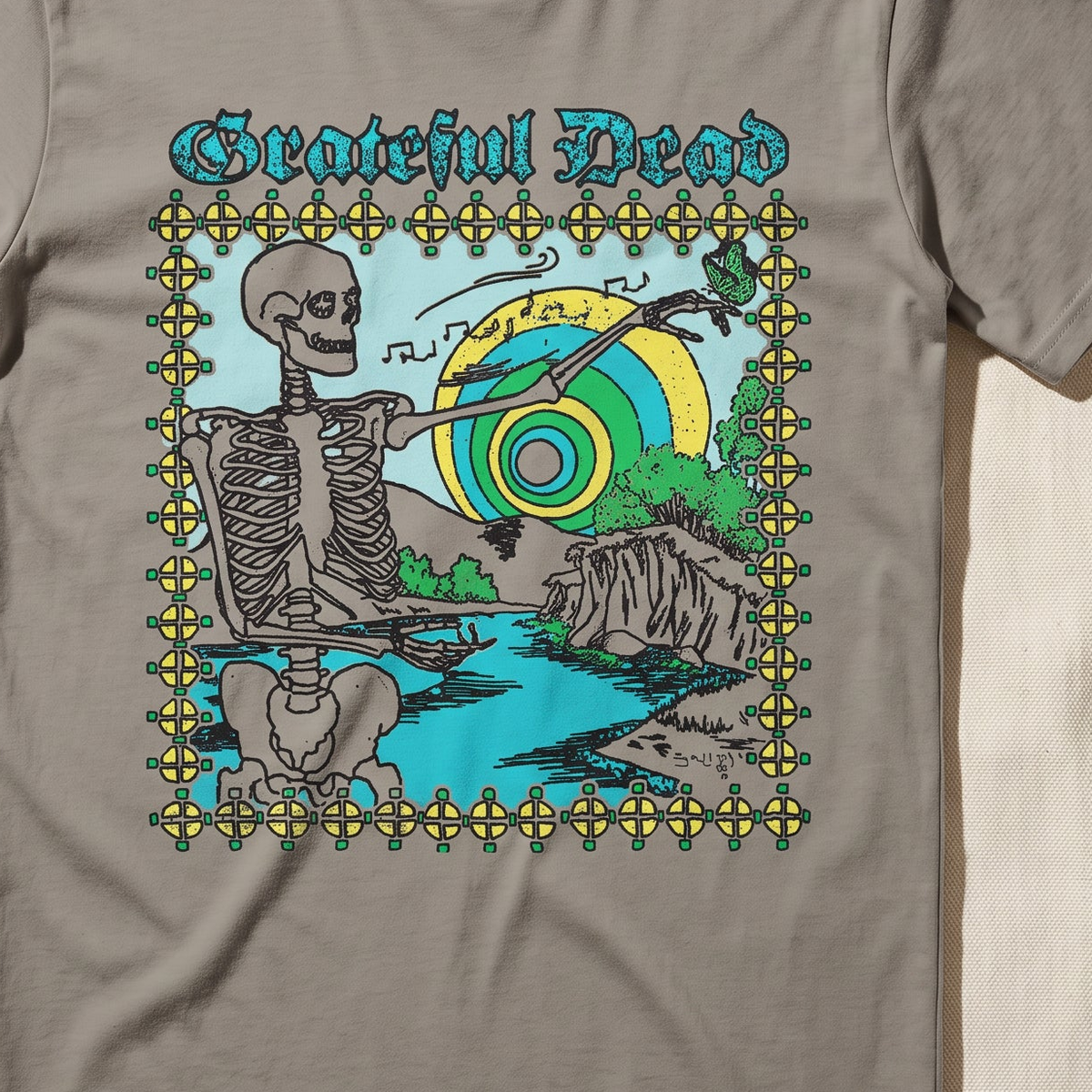 Close-up of the Riverside Serenade print on a sandstone t-shirt