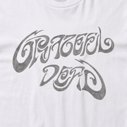 Close-up of the Scribble Wordmark print on a white t-shirt