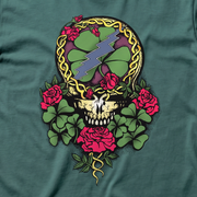 Close-up of the Steal Your Luck print on an emerald t-shirt