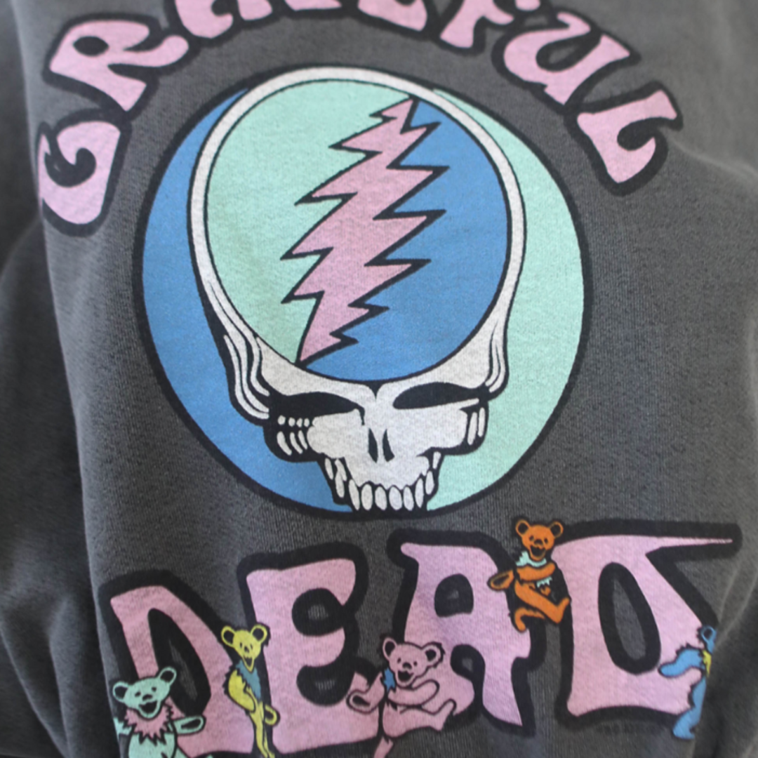 Close-up of Grateful Dead Steal Your Face logo with surrounding multicolor Dancing Bears on sweatshirt