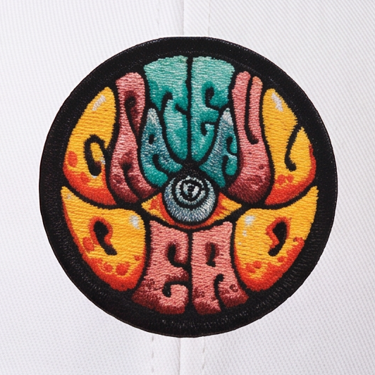 Close-up of the Drew Millward Trucker Hat design on a hat