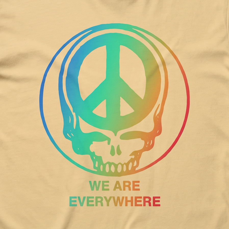 Close-up of the We Are Everywhere Peace Stealie print on a butter t-shirt