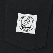 Close-up of the woven Stealie label on the pocket of a black long-sleeve t-shirt