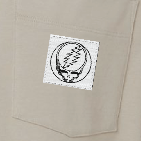 Close-up of the woven Stealie label on the pocket of a bone long-sleeve t-shirt