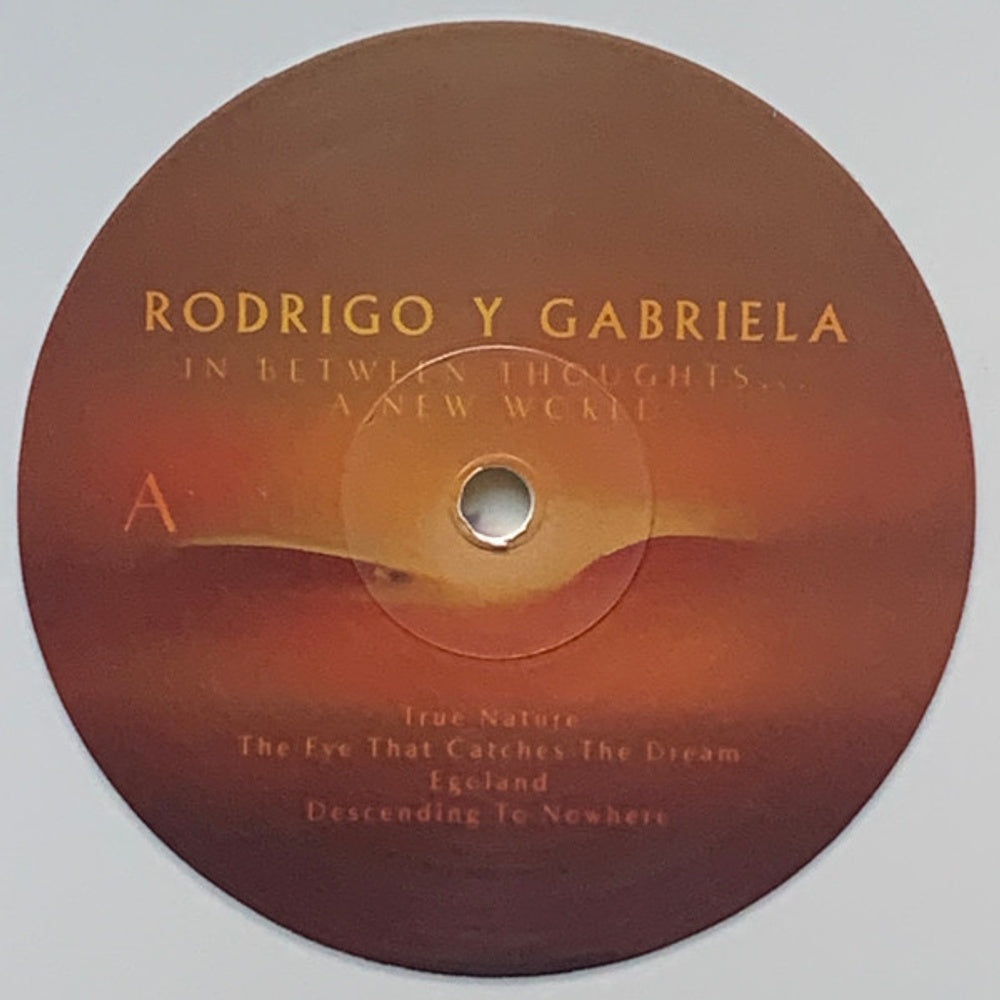 Label Disc: Rodrigo Y Gabriela – In Between Thoughts…A New World (Bone LP Vinyl) Vinyl LP | Relix