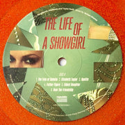 Label Disc: Taylor Swift – The Life of a Showgirl (Sweat and Vanilla Perfume Portofino Orange Glitter LP Vinyl) Vinyl LP | Relix
