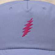Close-up of the design on the Grateful Dead Embroidered Magenta Bolt Surf Hat - Lapis