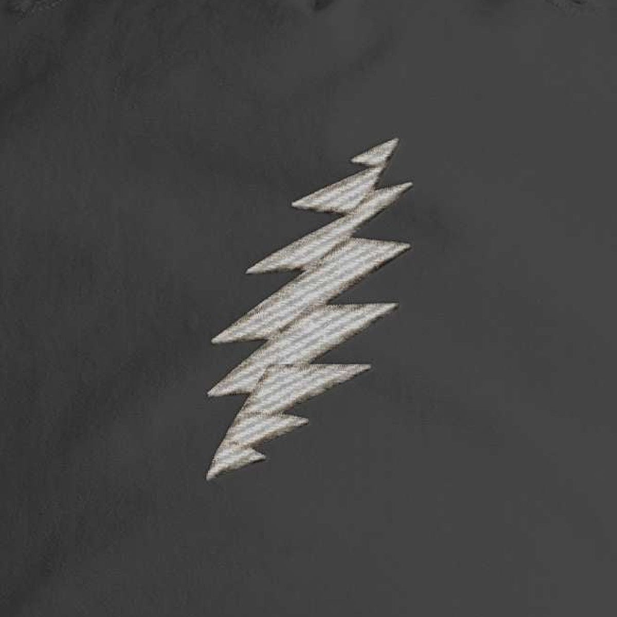 Close-up of the design on the Grateful Dead Embroidered Gray Bolt Surf Rope Cap - Black