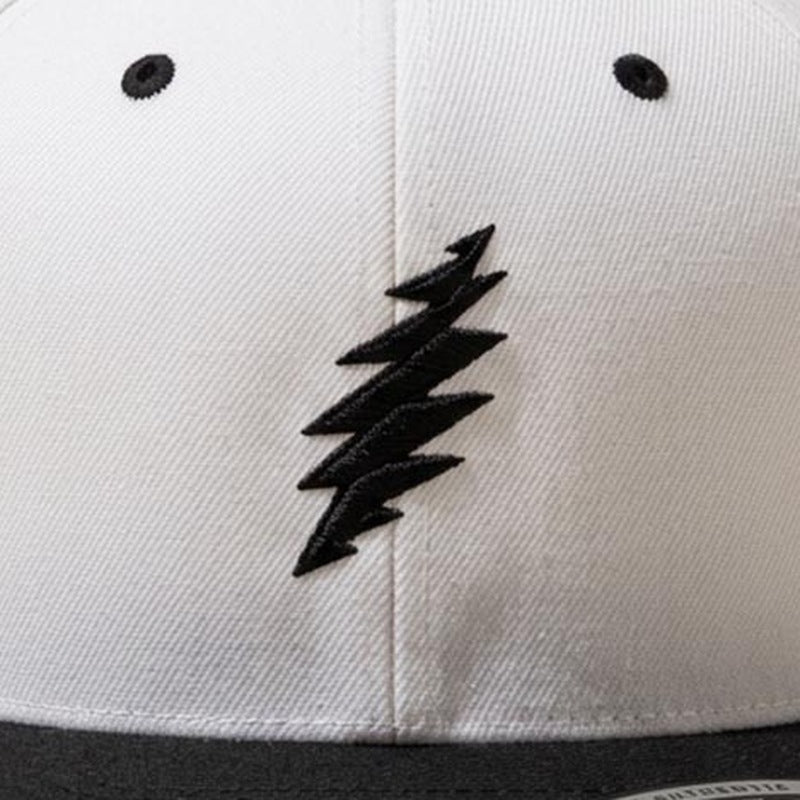 Close-up of the design on the Grateful Dead Embroidered Black Bolt Snapback Hat - Natural/Black