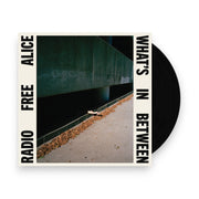 Packshot: Radio Free Alice – What's In Between (Black LP Vinyl) Vinyl LP | Relix