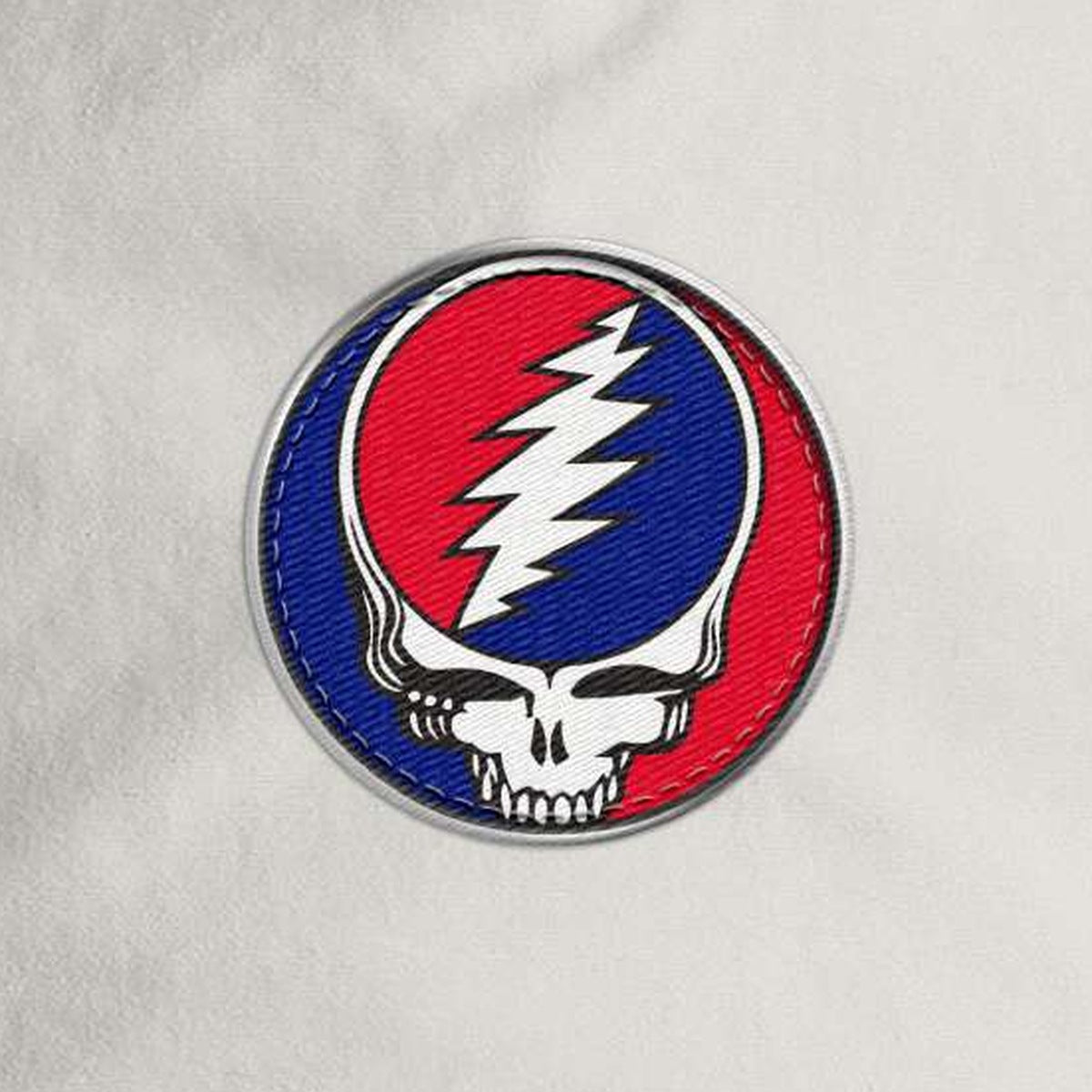 Close-up of the design on the Grateful Dead Embroidered Stealie Surf Rope Cap - Off-White