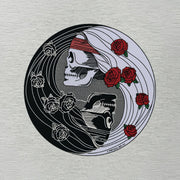 Close-up of vintage yin yang symbol graphic on throwback t-shirt
